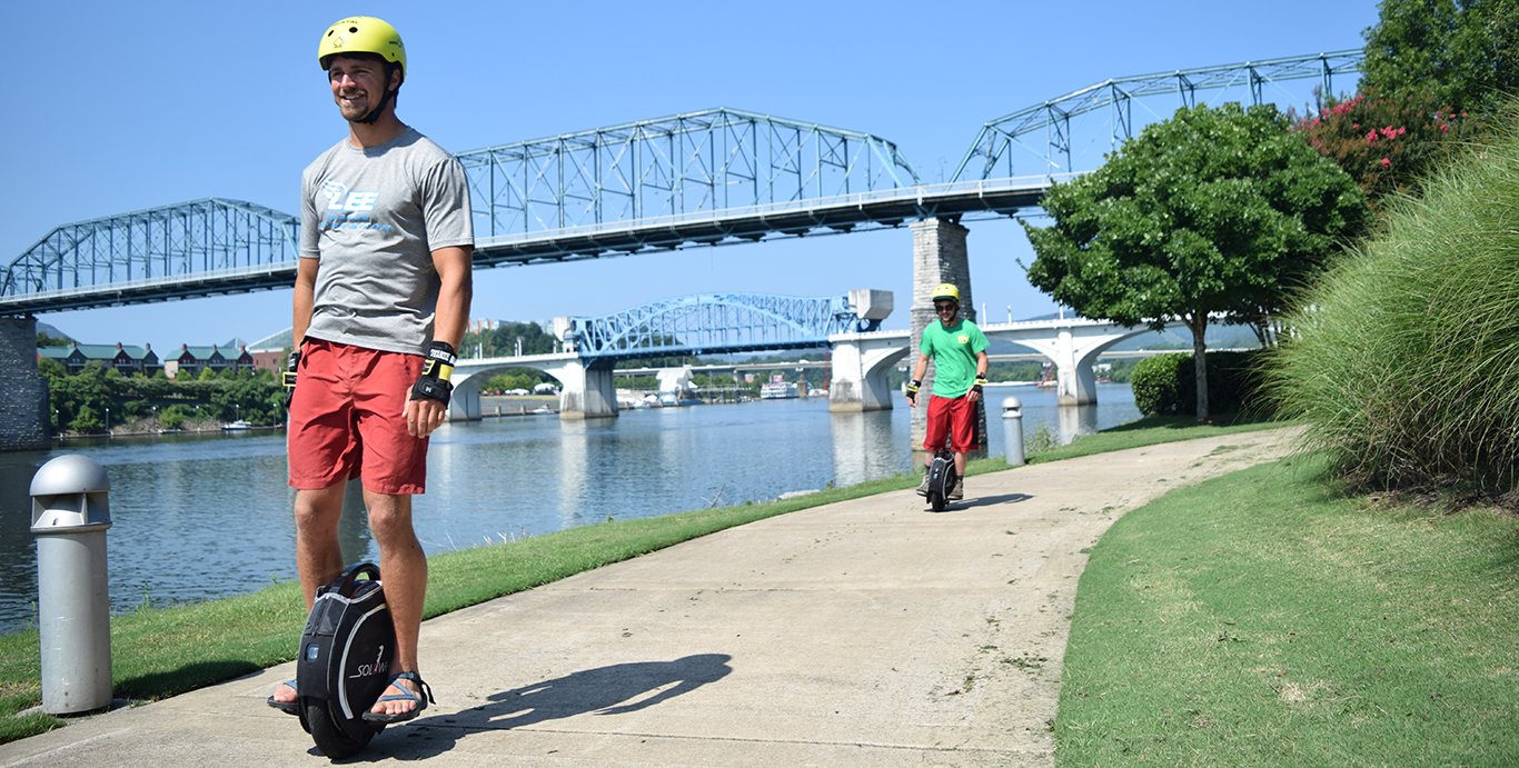 Riding e-unicycles by the Tennessee River