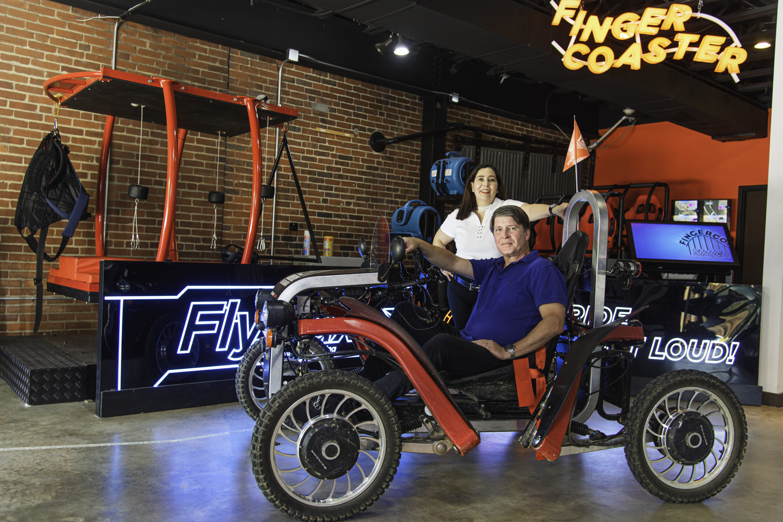 Picture of Patrick and Carolina Molloy, founders of Adventure Sports Innovation in a Swincar electric off-road vehicle