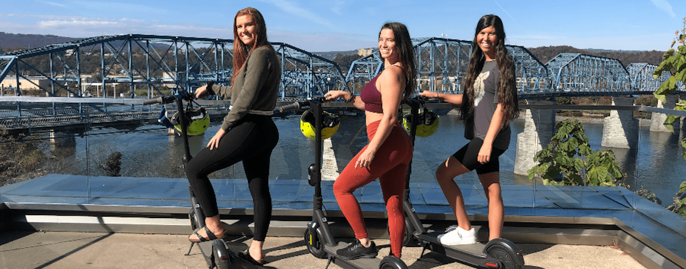 ChattaScooter riders on bridge